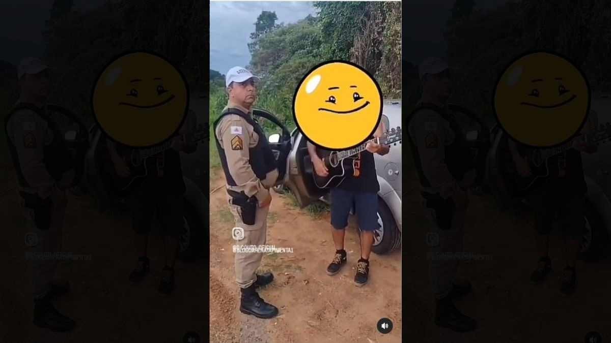 Policial é visto em print de vídeo assistindo um condutor embriagado com violão e cantando "Dormi na Praça".