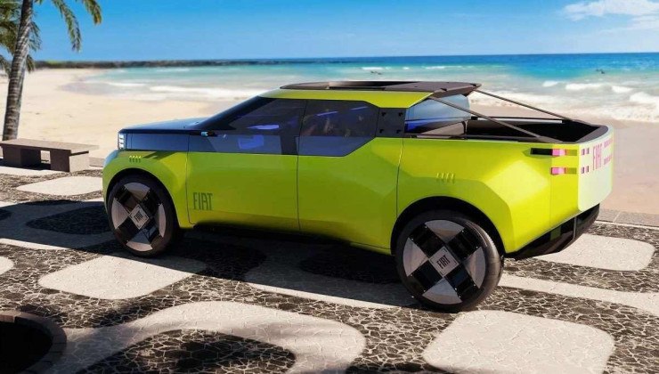 Fiat conceito amarelo em ch&atilde;o que parece Copacabana com praia ao fundo.
