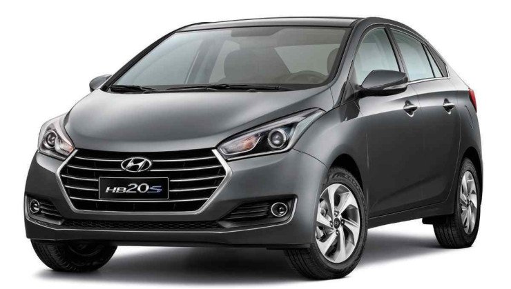 Hyundai HB20S cinza modelo 2016 de frente est&aacute;tico no est&uacute;dio