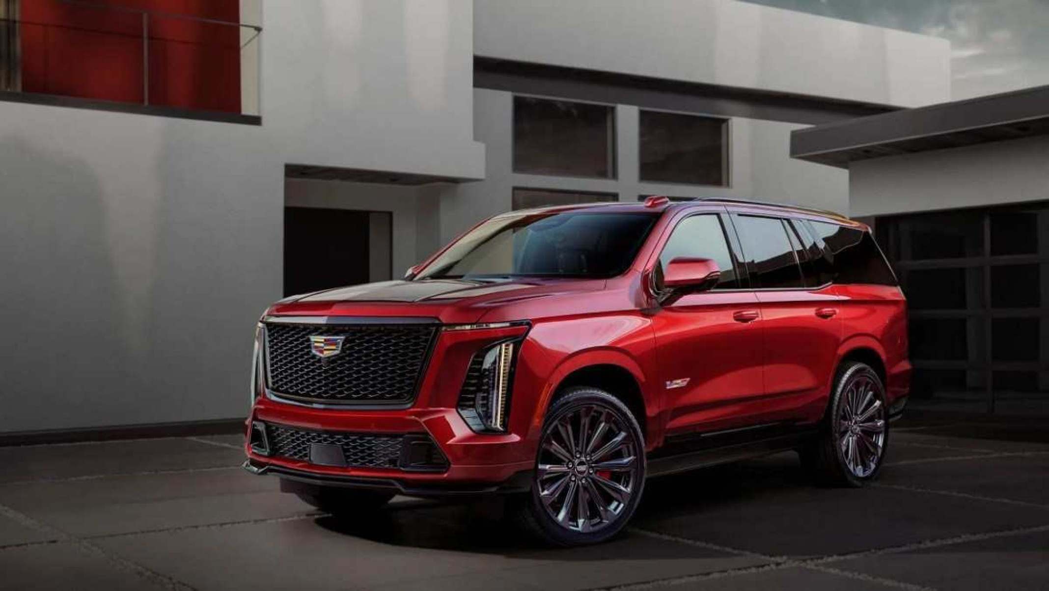 Cadillac Escalade 2025 vermelho metálico, de frente, estacionado