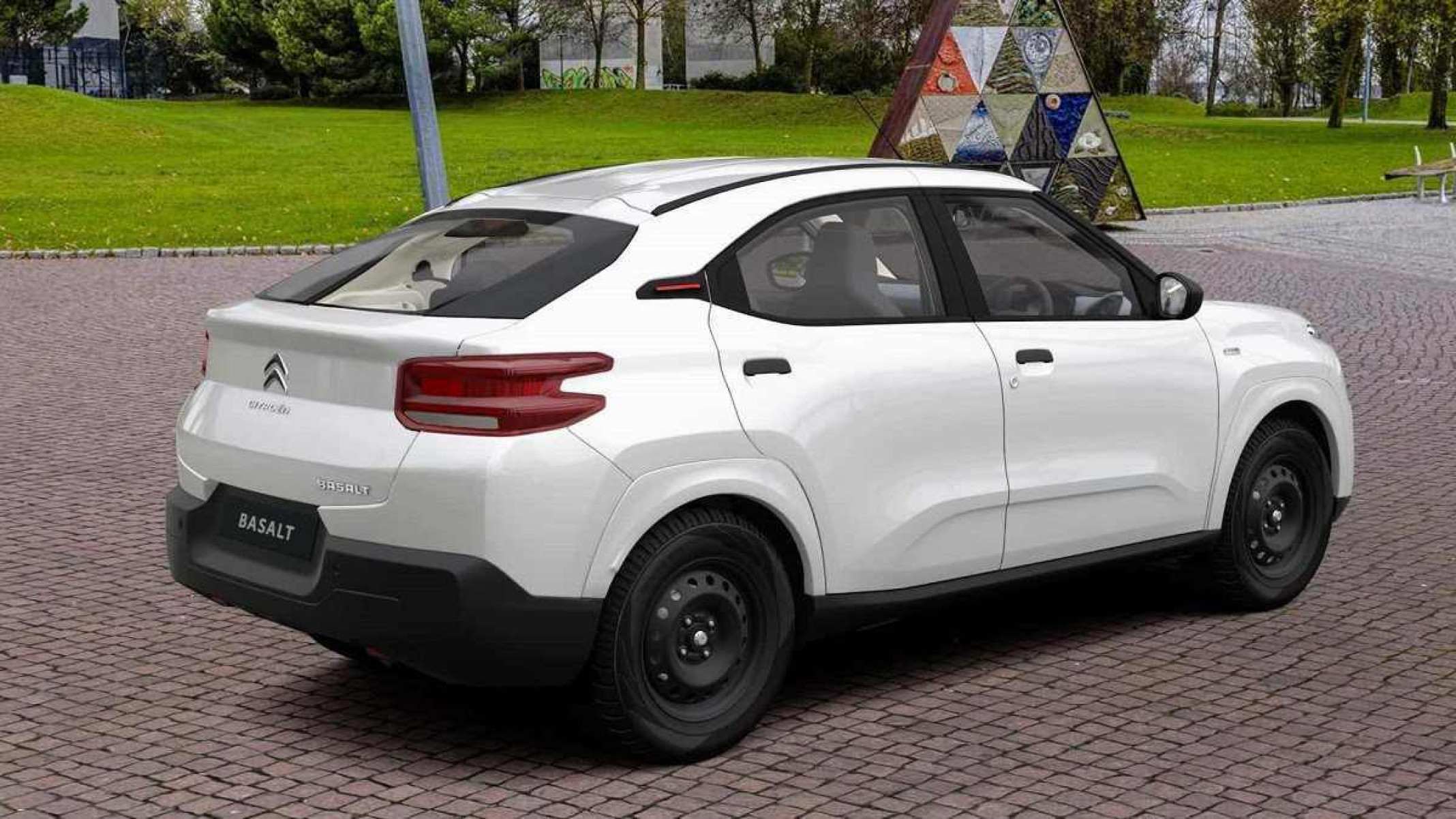 Citroën Basalto branco visto de lado, em piso asfáltico com grama ao fundo