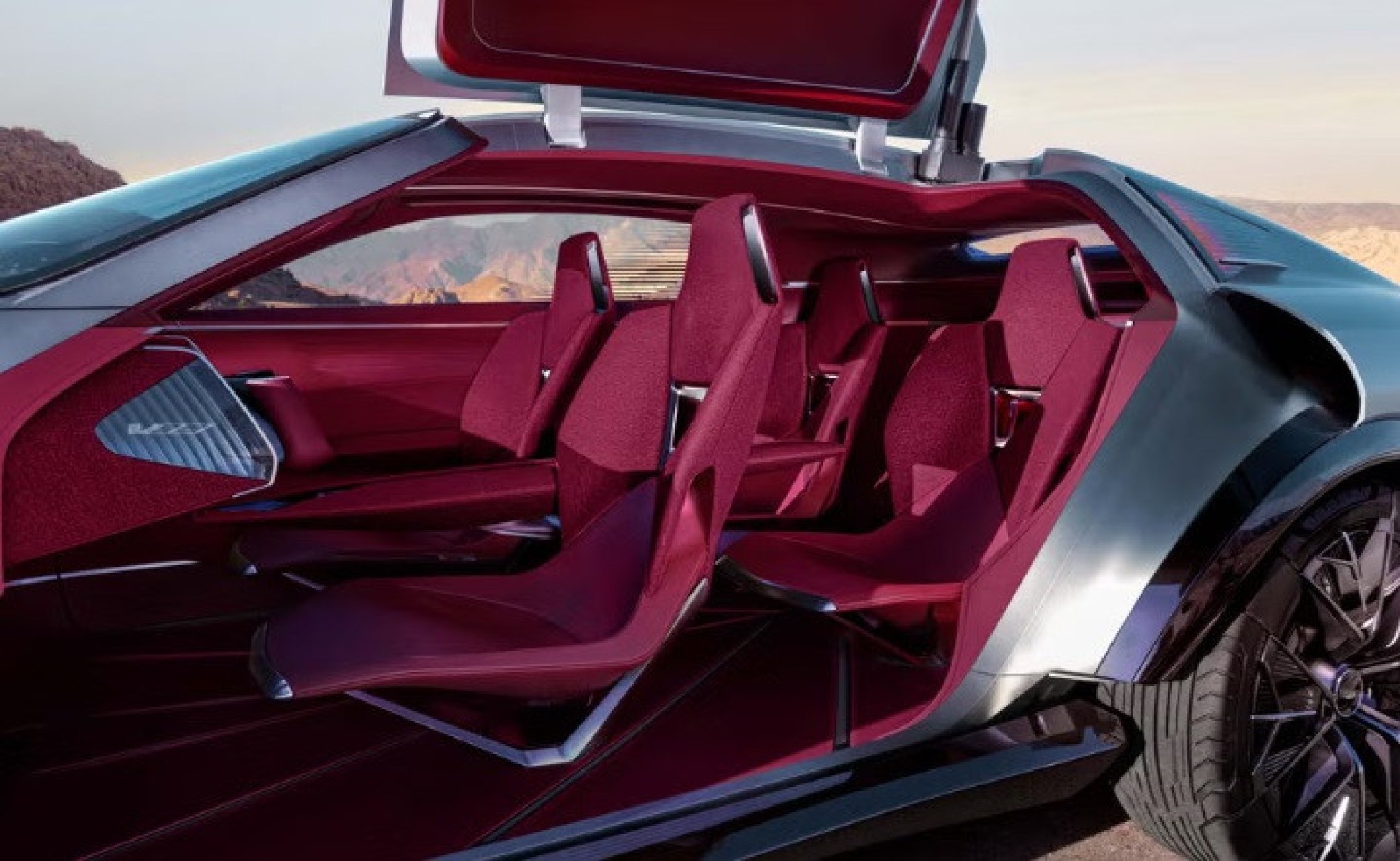 A cabine do Cadillac Elevated Velocity mistura couro Nappa vermelho com um tecido bouclé surrado e detalhes em metal escovado. 